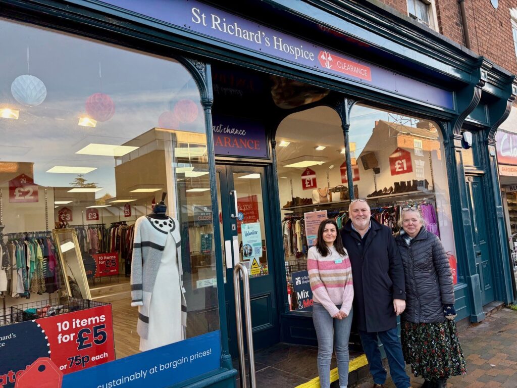 Three members of the St Richard's shops team stand outside the charity's Stourport shop